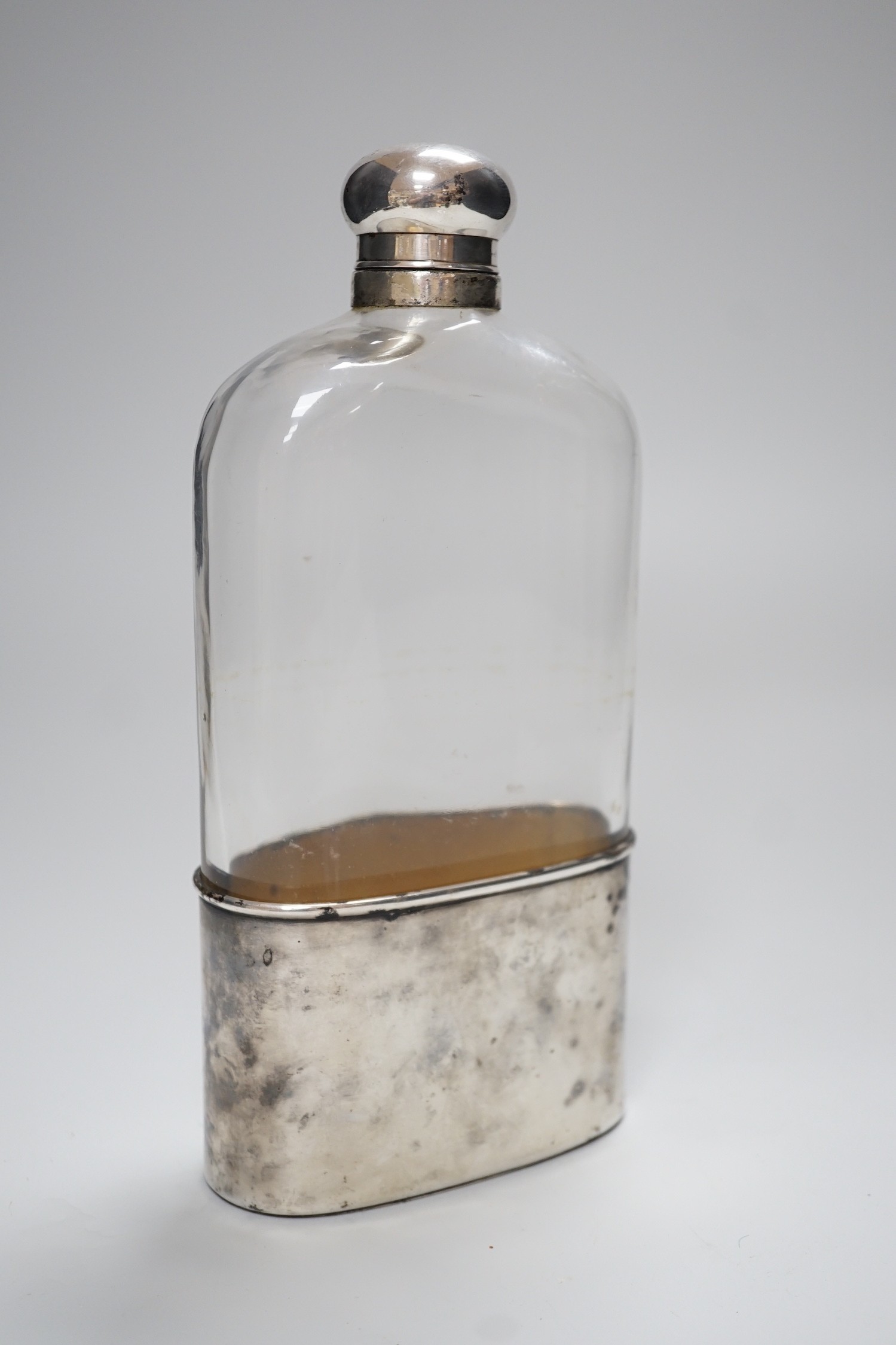 A Goliath size silver plate mounted hip flask, 23.5cm